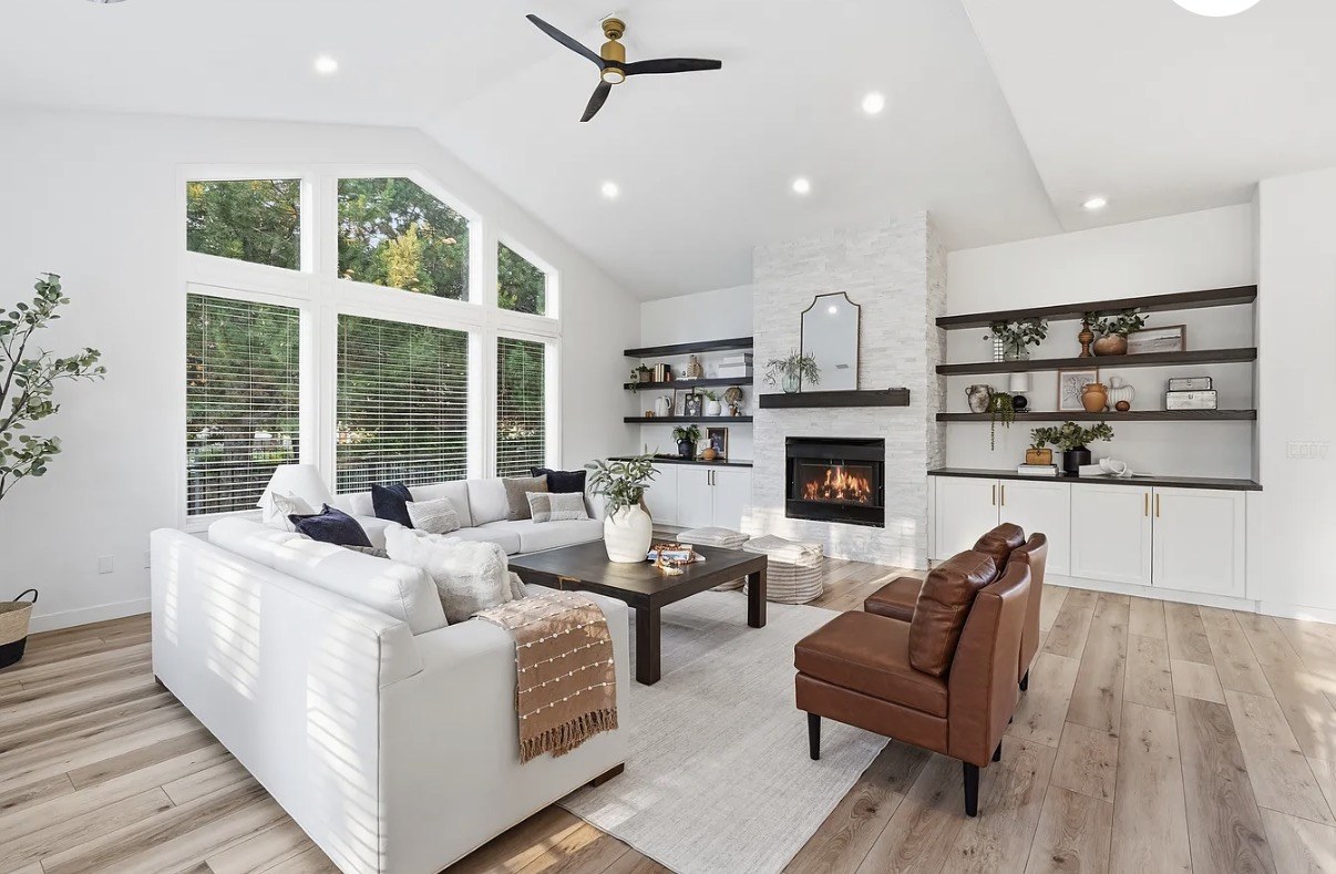 Fully staged living room with coordinated furniture, artwork, and accessories